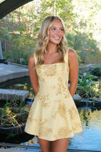 Yellow floral lace corset mini dress side angle outdoor