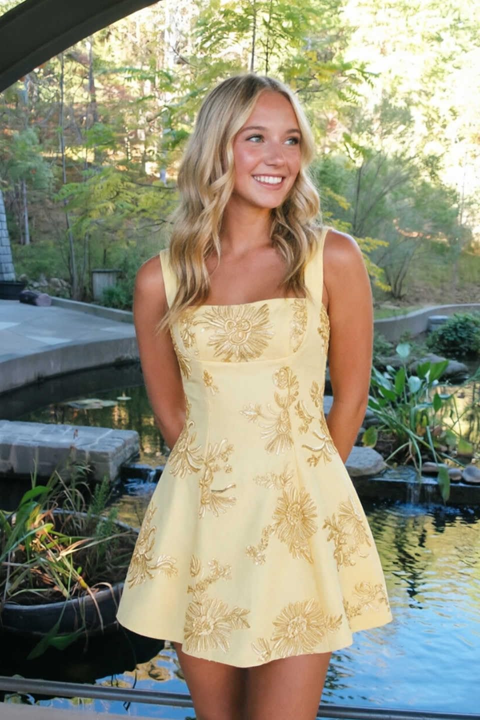 Yellow floral lace corset mini dress side angle outdoor